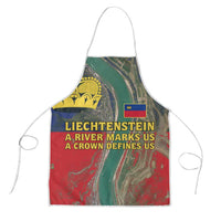 Colorful apron with yellow crown emblem and red/blue aerial river print, white ties