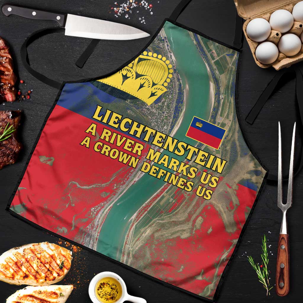 Apron laid flat with yellow crown emblem, small blue-red flag badge, red-green river print