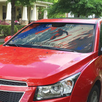 Car windshield sun shade with red, blue, and gray alpine ski design and mountains