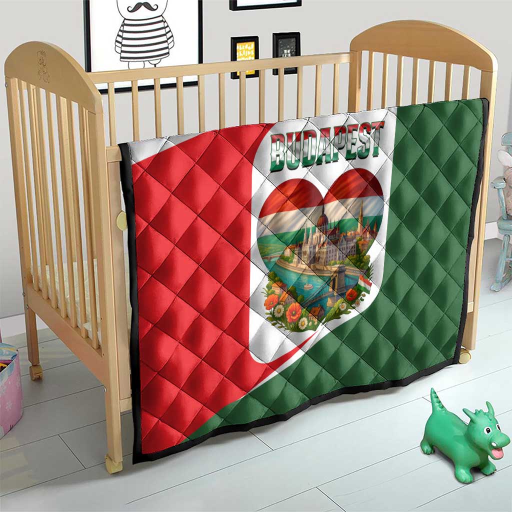 Quilted crib blanket with Budapest heart emblem on red, white, and green fabric