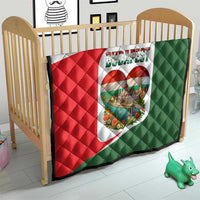 Quilted crib blanket with Budapest heart emblem on red, white, and green fabric