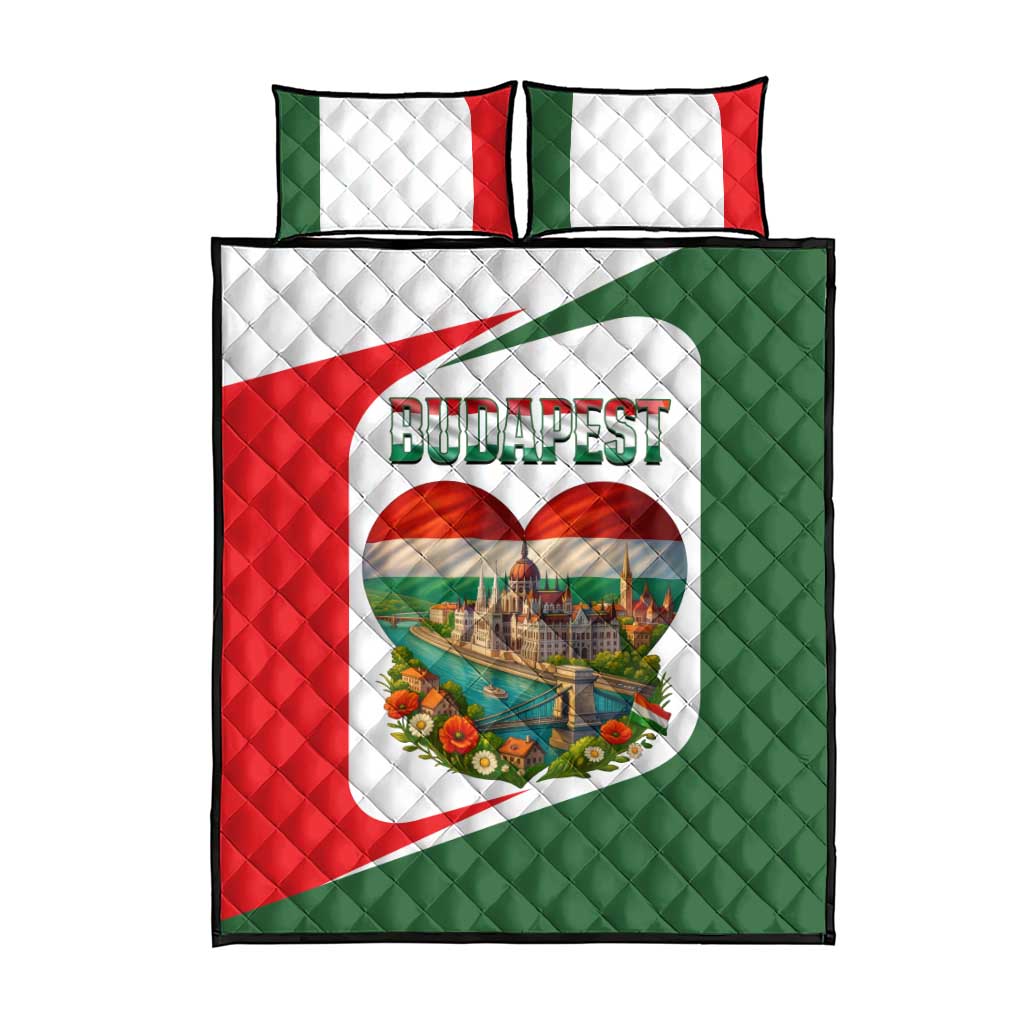Multicolor quilt and matching pillows with Budapest heart emblem on red and green