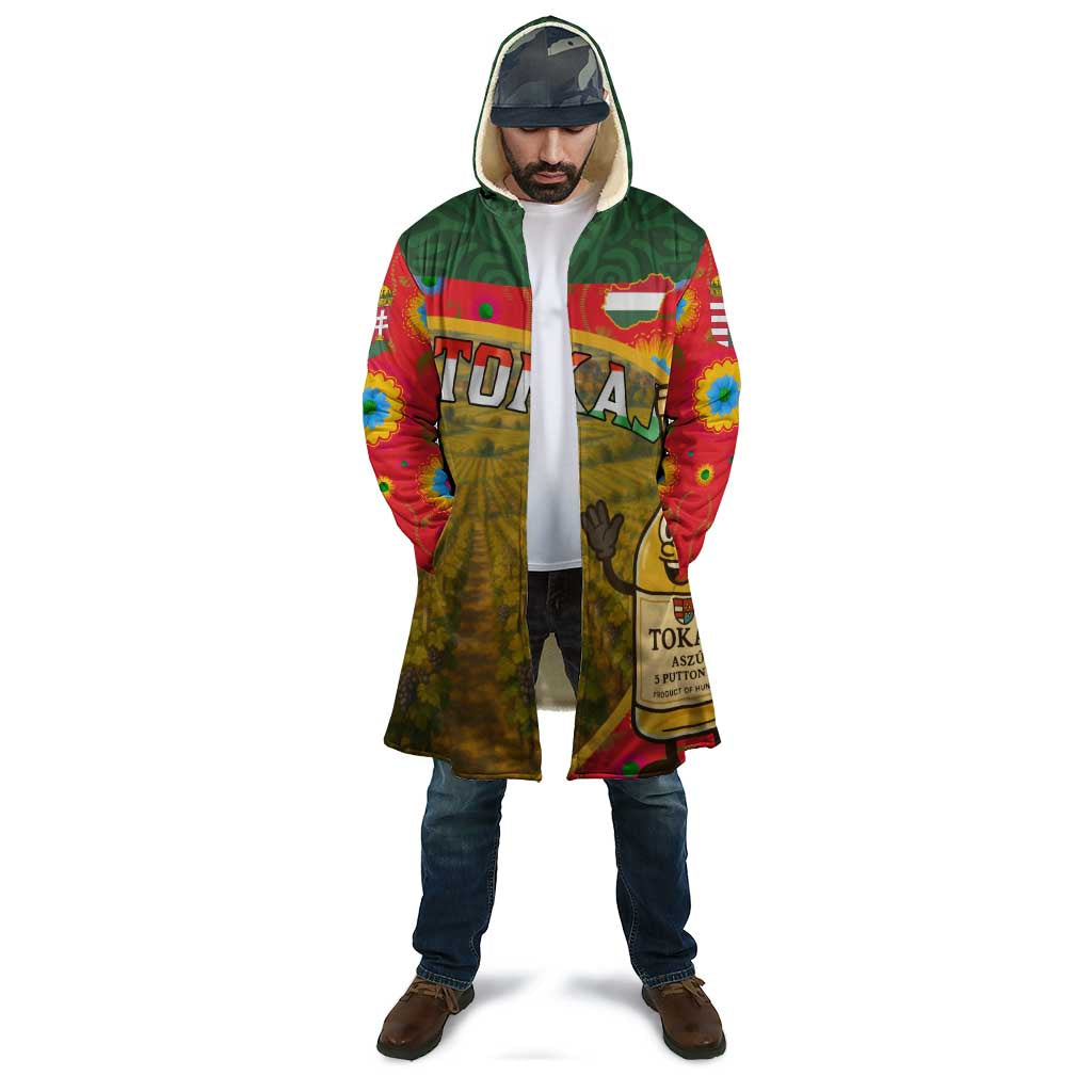 Unisex hooded cloak worn over jeans, colorful Hungary Tokaj grape bottle print