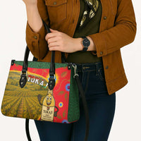 Multicolor tote bag with black straps and Tokaj graphic on the front
