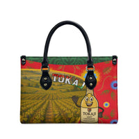 Multicolor rectangular tote bag with black top handles and Tokaj wine graphic