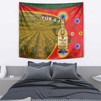 Multicolor Hungary tapestry featuring Tokaj vineyard landscape and wine-bottle character.
