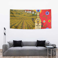Hungary tapestry showing Tokaj vineyard fields and cartoon wine bottle on a multicolor design.