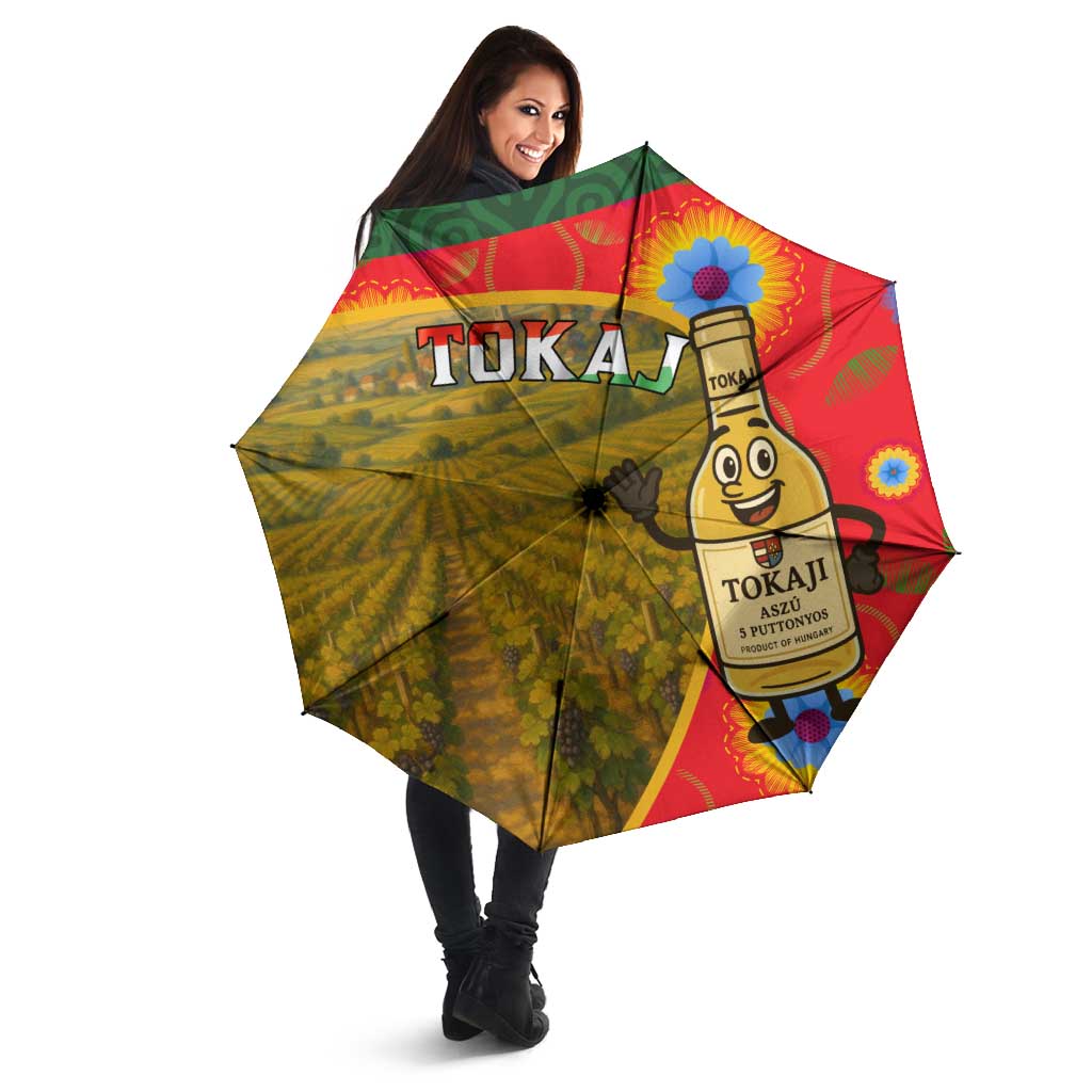 Open umbrella with Tokaji bottle and vineyard illustration, held by woman