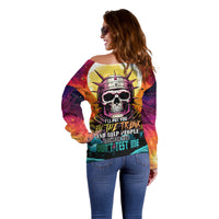 Off-shoulder multicolor sweater with astronaut skull graphic, back side view.