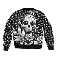Black unisex bomber jacket with skull and floral print, ribbed collar and cuffs