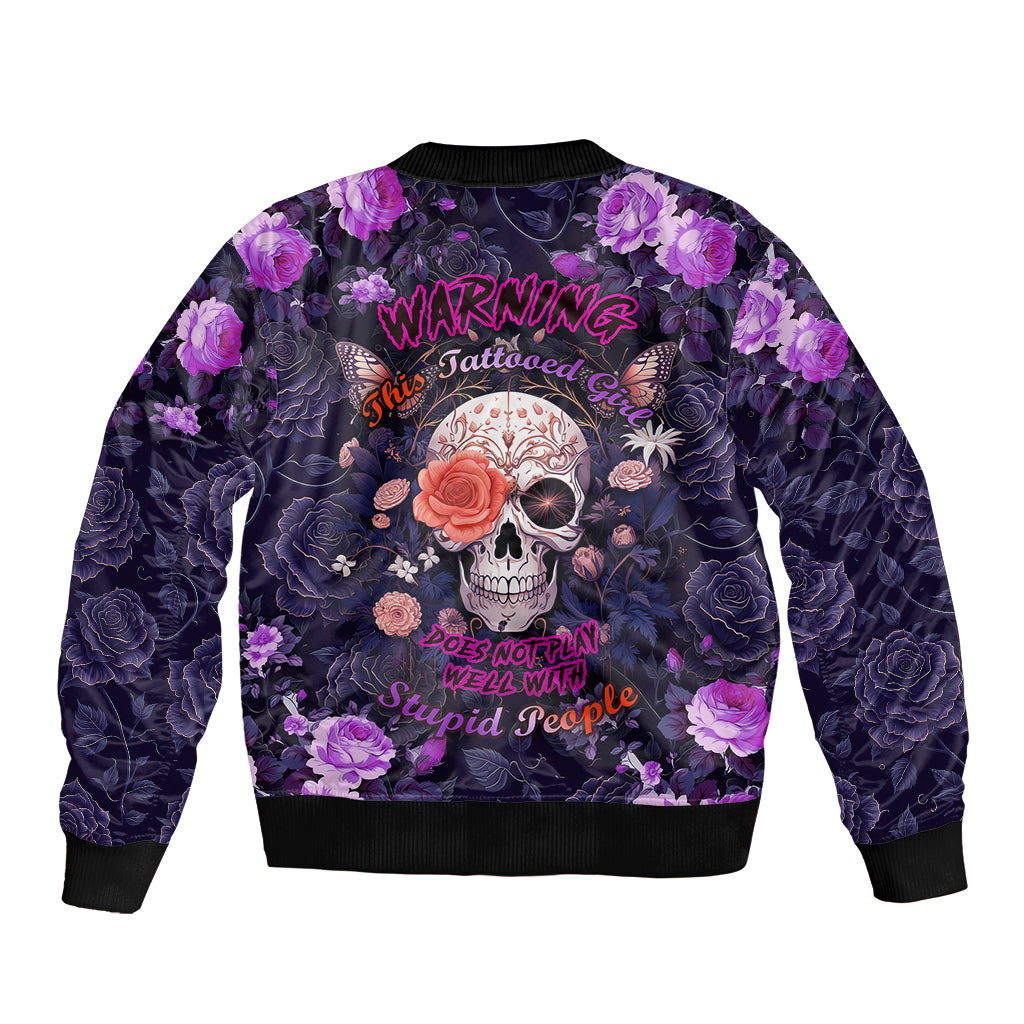 Multicolor bomber jacket with purple roses, skull graphic, and 'Warning' text on back