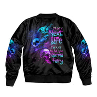 Black bomber jacket with multicolor skull-fairy graphic on back, ribbed cuffs