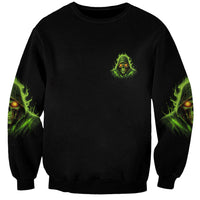 Unisex black sweatshirt with small neon green skull graphic on front and sleeves