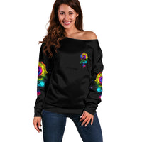 Black off-shoulder sweater with colorful rose graphic on front