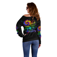 Black off-shoulder sweater with colorful rose smoke graphic on back