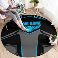 Round black carpet with gray jersey design, blue winged emblem, and “TEAM NAME” text.