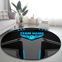 Round black rug featuring gray jersey print with blue winged emblem and “TEAM NAME”.