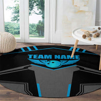 Round black carpet with gray jersey graphic, blue winged emblem, and “TEAM NAME” center.
