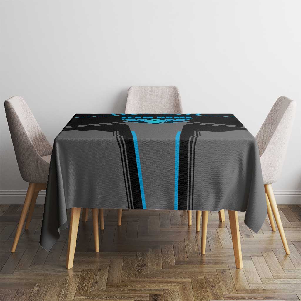 Black and blue bowling tablecloth on square table with four chairs