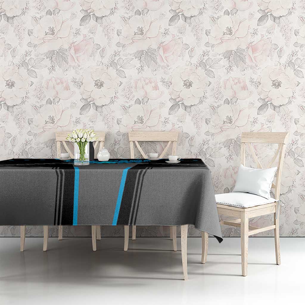 Black and blue bowling tablecloth on dining table with chairs and table decor