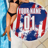 Circular beach blanket with blue red white splatter; custom name and 01, fringed edge