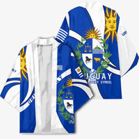 Blue and white Uruguay kimono front with crest, sun artwork, and open drape design