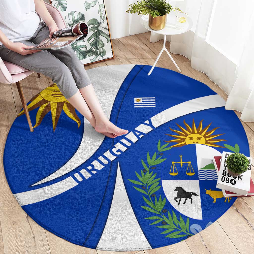 Round Uruguay national emblem rug in blue and white wave design with sun and scales