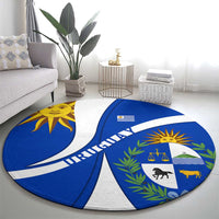 Circular blue and white Uruguay emblem rug with sun crest and decorative laurel leaves
