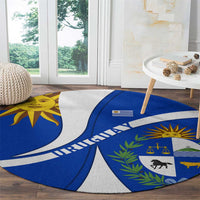 Round Uruguay emblem carpet with blue field, white stripes, sun symbol, and laurel border