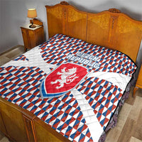 Czech Republic quilt on bed with blue red white geometric pattern and lion shield center