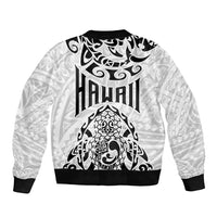 Black and white bomber jacket with crew neck and HAWAI'I logo over turtle artwork