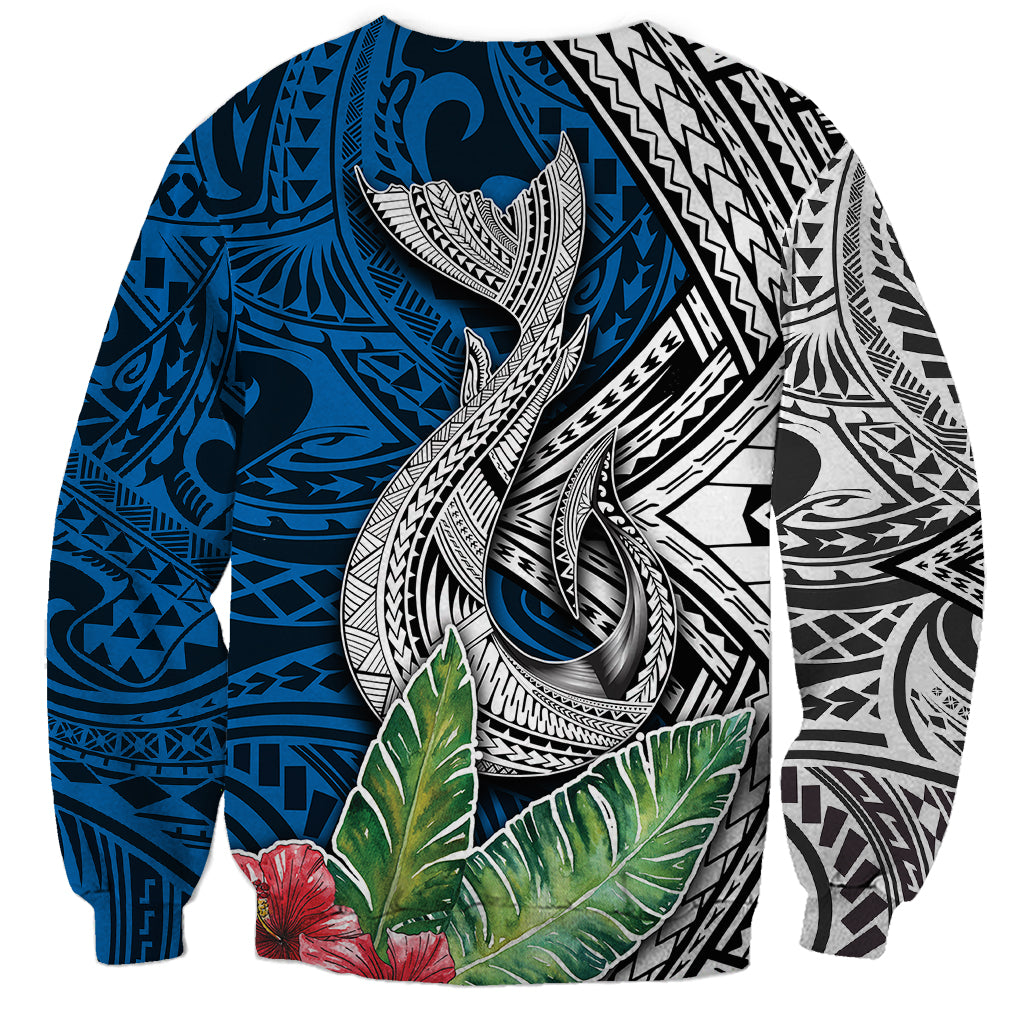 Unisex tropical sweatshirt with central whale graphic, blue pattern and green leaves