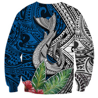 Unisex tropical sweatshirt with central whale graphic, blue pattern and green leaves