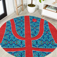 Round Turkish-style patterned rug with blue and red circular emblem medallion