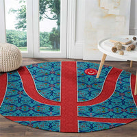 Round Turkish pattern rug, blue with red center stripe and emblem-style medallion