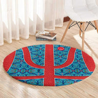 Round blue and red Turkish-style patterned rug with central crescent-and-star emblem
