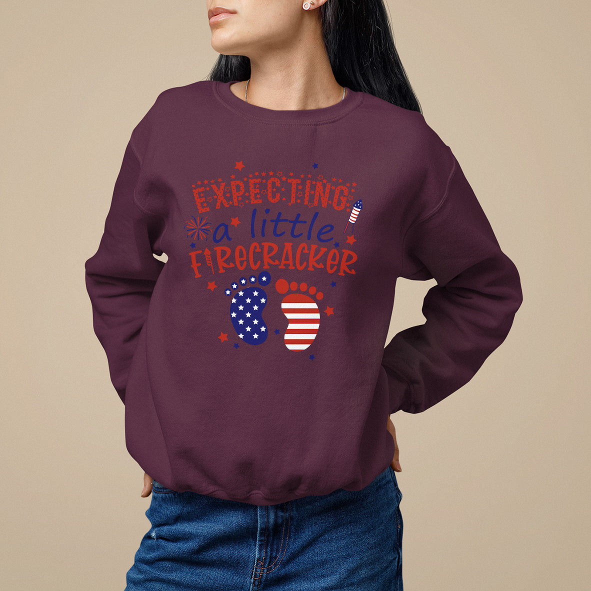 Maroon pregnancy announcement sweatshirt with expecting a little firecracker graphic and flag circles