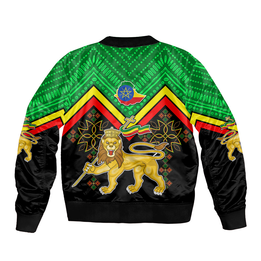 Unisex bomber jacket, black with green patterned shoulders and centered Ethiopia coat of arms
