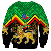 Unisex sweatshirt coat with green upper and black sleeves, lion crest and star emblem