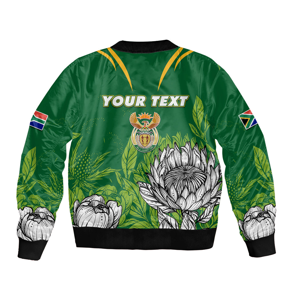 Green bomber jacket with black rib trim, front zipper, 'YOUR TEXT' and crest floral print