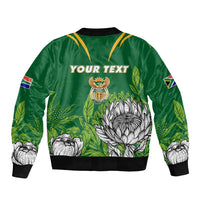 Green bomber jacket with black rib trim, front zipper, 'YOUR TEXT' and crest floral print