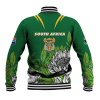 Green baseball jacket back with striped hem, South Africa crest and protea floral artwork