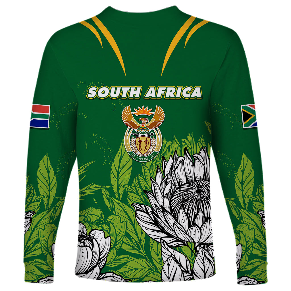 Green long-sleeve jersey with yellow V trim, South Africa text, crest, leaf and protea print