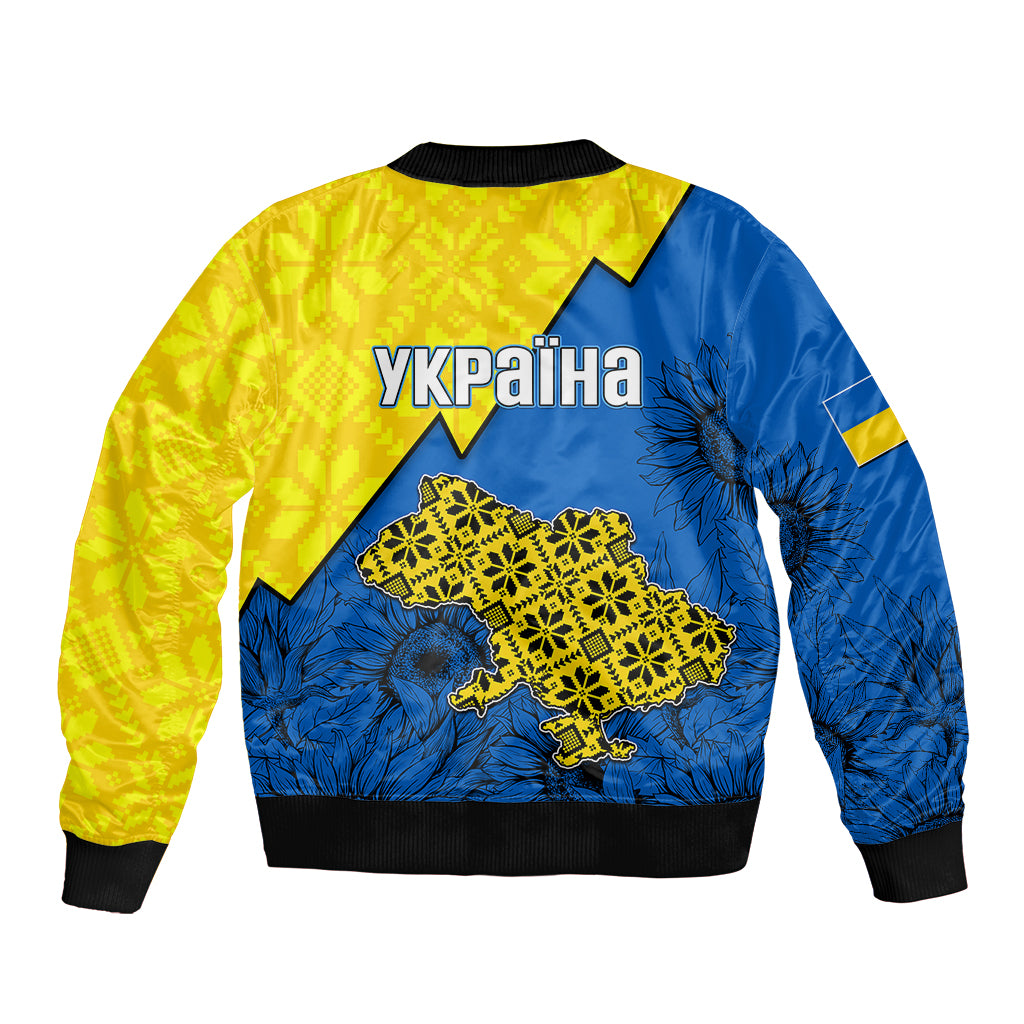 Unisex bomber jacket in yellow and blue, back text UKRAINA with folk map graphic.