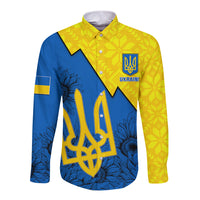 Long-sleeve button shirt in yellow and blue with folk pattern, emblem, floral motifs