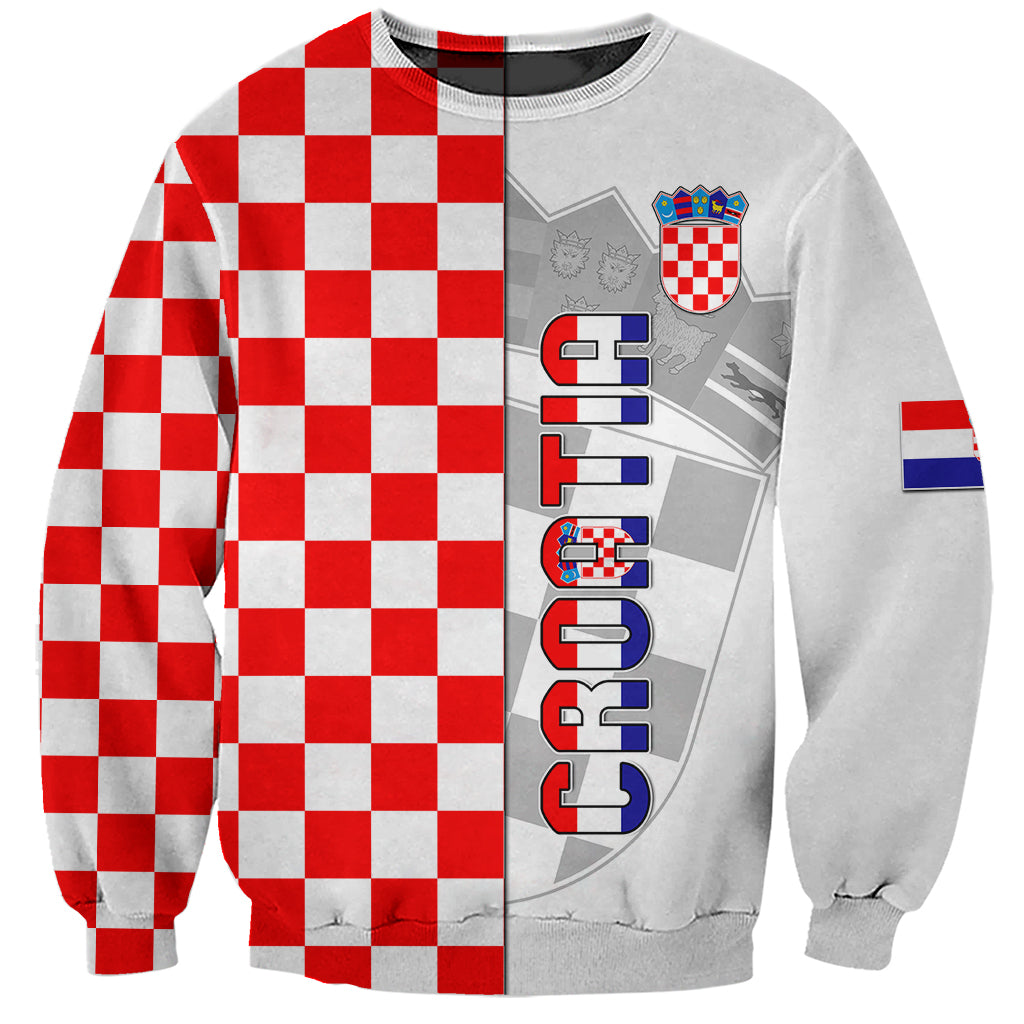 White unisex sweatshirt with red-and-white checker panels, crest and vertical logo print