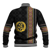 Black baseball jacket back with gold crest, striped cuffs, and colorful vertical pattern strip