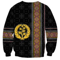 Black unisex sweatshirt with gold laurel tree emblem, vertical stripe, patterned cuffs