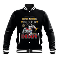 Black baseball jacket with striped collar and gaming-themed front graphic.