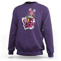 Purple crewneck sweatshirt with colorful bunny graphic on chest, long sleeves.